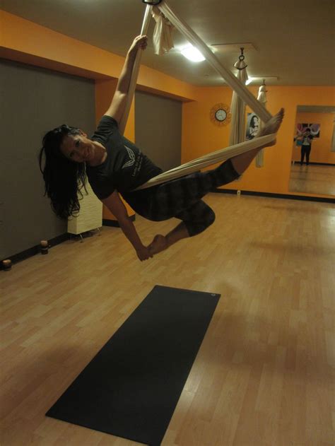 body  mind practicing aerial yoga feel alive  inspired