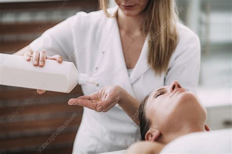 physical therapist massaging female patient stock image