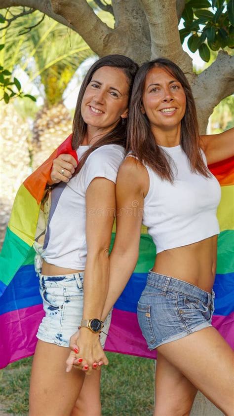 Spanish Lesbian Couple Posing With A Pride Flag Stock Image Image Of