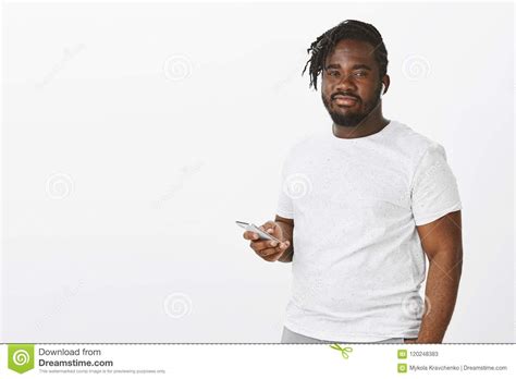 Indoor Shot Of Carefree Confident Fat Guy In White T Shirt