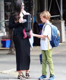 liv tyler carries newborn sailor in a sling with son milo in new york