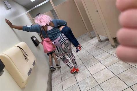 mum photographed making her son do push ups in public toilet as