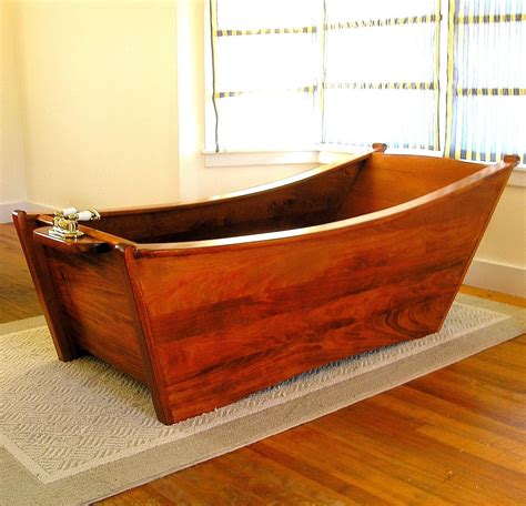 hand crafted wooden bathtub   person  bath  wood  maine llc