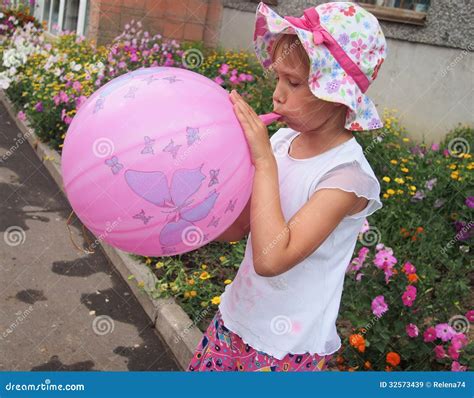 girl blowing  balloon stock image image  street young