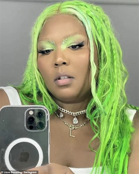 Lizzo Models Glittering Metallic Bra And Slime Green Hairdo Daily