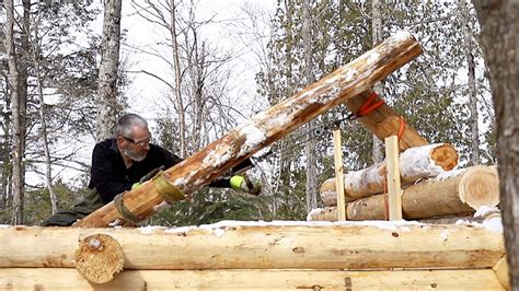 lifting   pound  kilos log   roof   log cabin