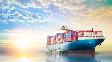 international container cargo ship   ocean  sunset sky freight