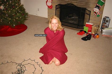 beautiful middle aged wifey posing naked at the christmas tree