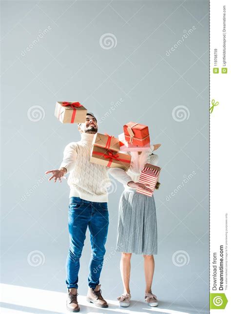 couple catching falling wrapped stock image image  christmas season