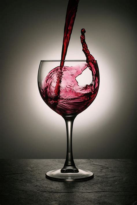 Dramatic Red Wine Splash Into Wine Glass Photograph By Donald Gruener