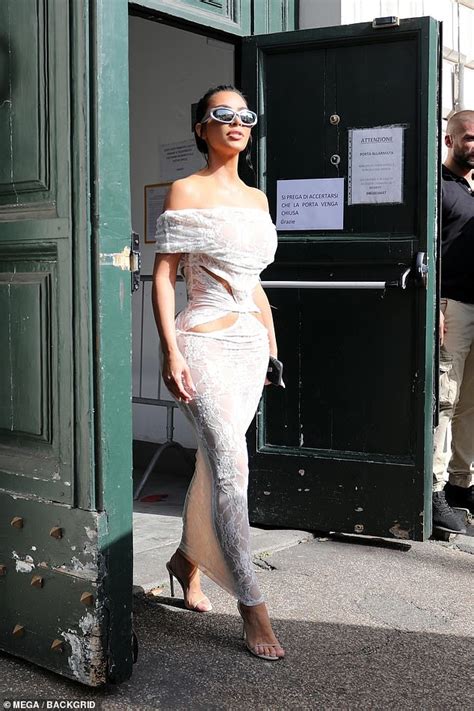 Kim Kardashian Shows Off Her Sensational Curves In A White Lace Dress