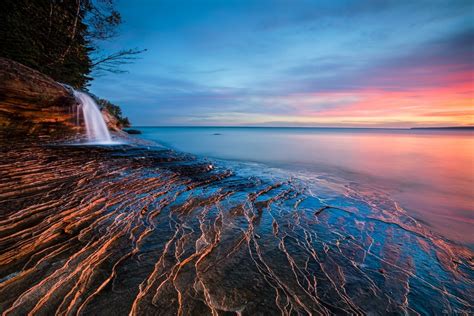 nature landscape sunset lake waterfall clouds water beach blue