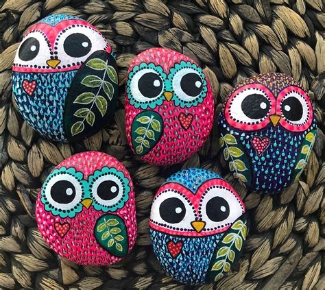 painted rocks  owls sitting  top     front