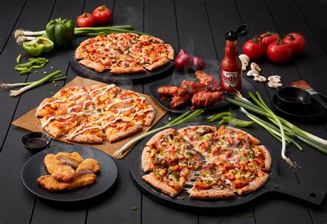 dominos launches   chicken products worth crossing  road  bt