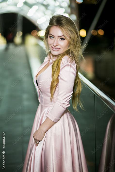 luxury beautiful blonde with long hair and big boobs in dress stock