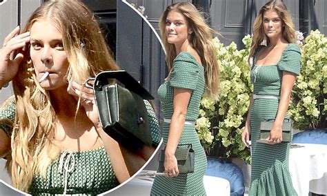 nina agdal enjoys a smoke while showcasing her chic bohemian style in