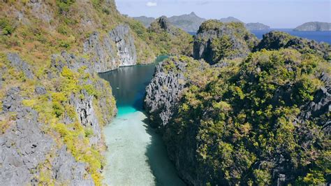 Aerial Footage Of Big Lagoon With Sharp Rocks And Clear Blue Water In