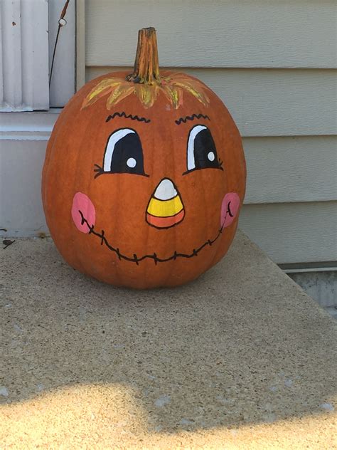 pumpkin   angry face painted   side sitting  front