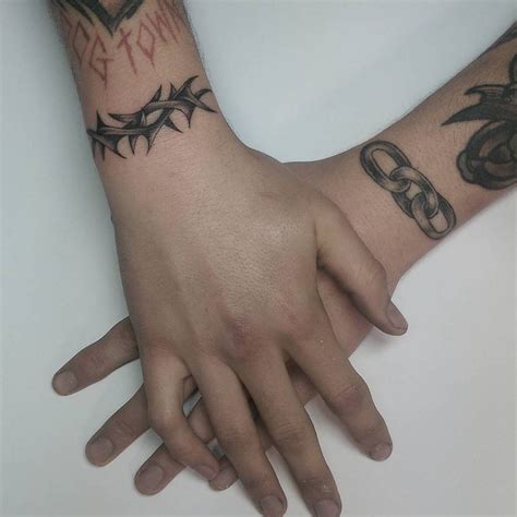 thorn and chain wrist tattoos
