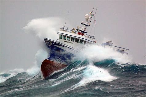 fishing vessel harvester battles  waves mirror