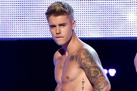 Justin Bieber Gets Chest Tattoos Teen Vogue