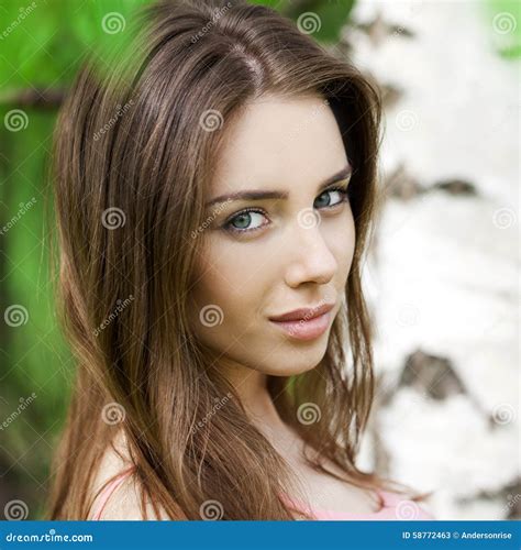 Russian Beauty Young Brunette Girl At A White Birch Stock Image