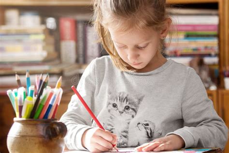 girl coloring   coloring book stock photo image  paper pencil