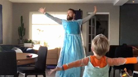 dad and son dance to frozen s let it go dressed as elsa in viral video