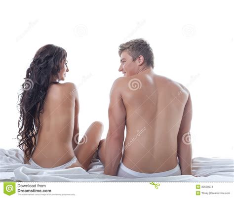 het slanke naakte man en vrouwen stellen in bed stock foto