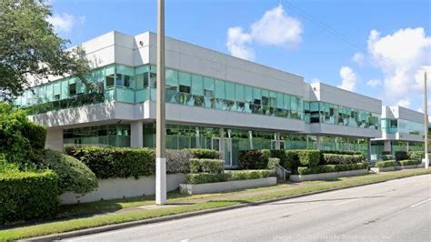 spa world sells coral gables office building  midtown capital