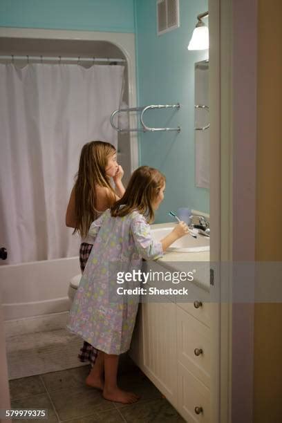 girl in public shower photos and premium high res pictures getty images
