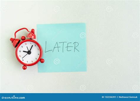 procrastination postpone  laziness concept red alarm clock