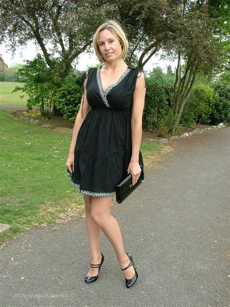 hot milf monica posing in a gorgeous short black dress