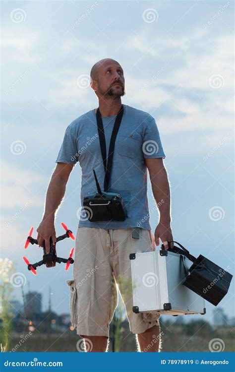 drone pilot standing   field stock image image  person equipment