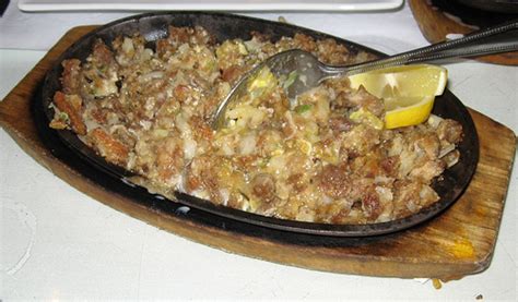 how to cook sisig an authentic filipino recipe delishably