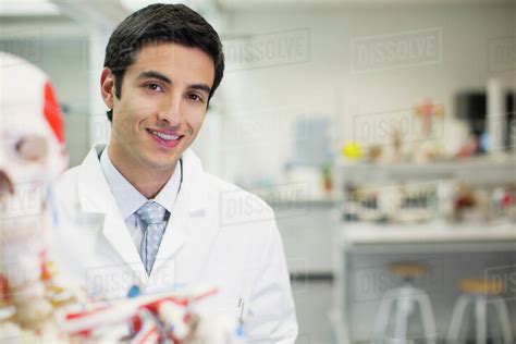 portrait  smiling scientist  anatomical model  laboratory