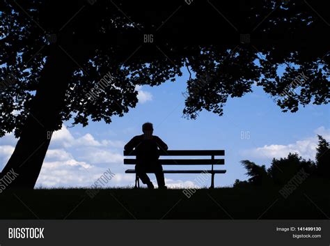 man sitting   park bench image photo bigstock