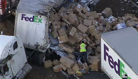 Fedex Truck Overturns On Highway And Spills Packages On Busiest