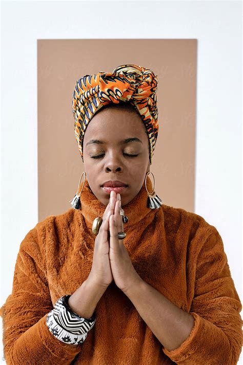 Praying African American Woman By Stocksy Contributor Clique Images