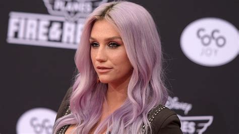 kesha says f k the world with new ankle tattoo entertainment tonight