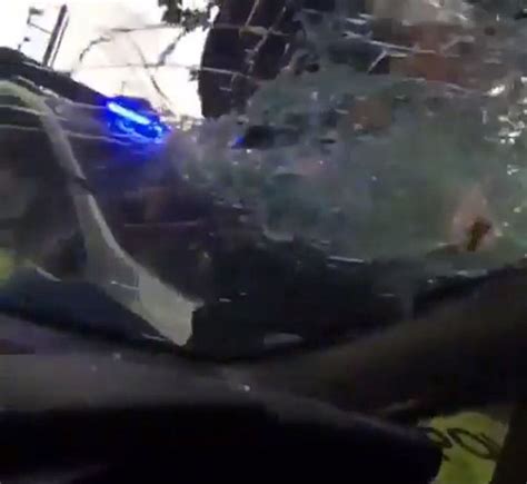 police officer attacks car and smashes window in case of