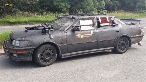 armed police surround machine gun equipped car owned  mad max fan