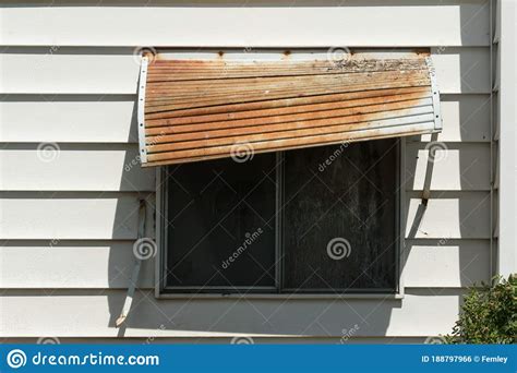 crooked rusty window awning stock photo image  city downtown
