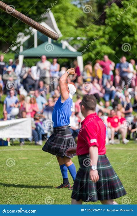 Tossing The Caber Discipline At Scottish Highland Games Editorial Photo