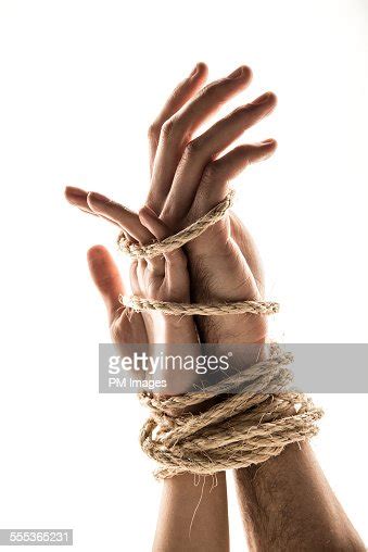 hands bound together photo getty images