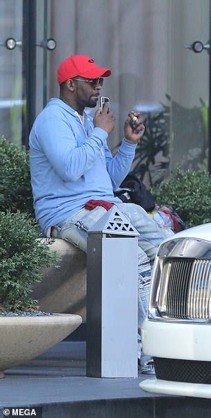 R Kelly Smokes Cigar Outside Of His Chicago Apartment