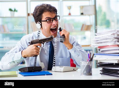 unhappy angry call center worker frustrated  workload stock photo