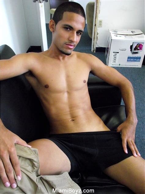sexy solo latino model strips off his tee shirt and shorts