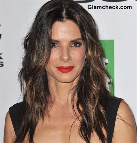 sandra bullock s age defying curly do and red hot lippie