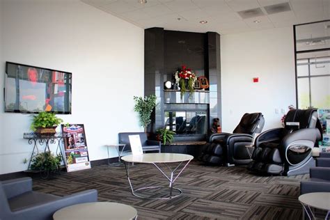 look at these massage chairs in the waiting room of a car dealership